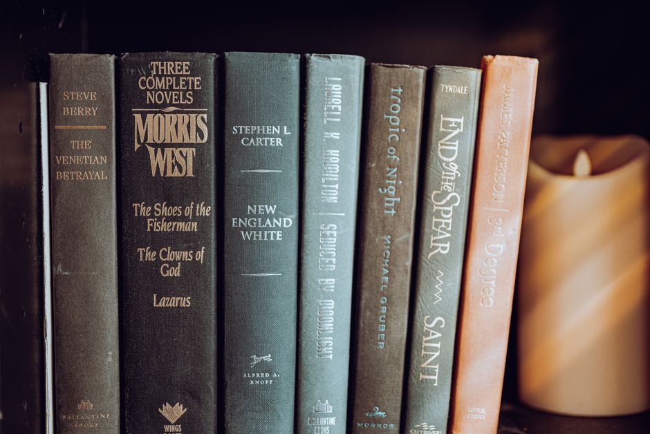 Close-up of a bookshelf with classic and modern novels. Perfect for book lovers.