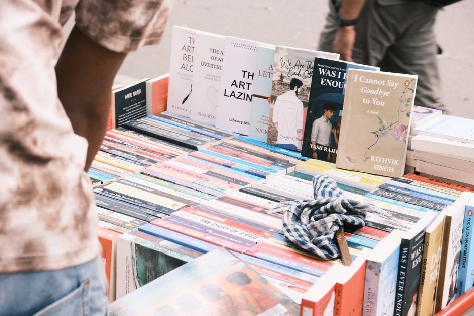 An open book with pages turning, captured outdoors, creating a dreamy reading atmosphere.